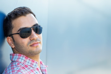 Portrait of beautiful guy with sunglasses
