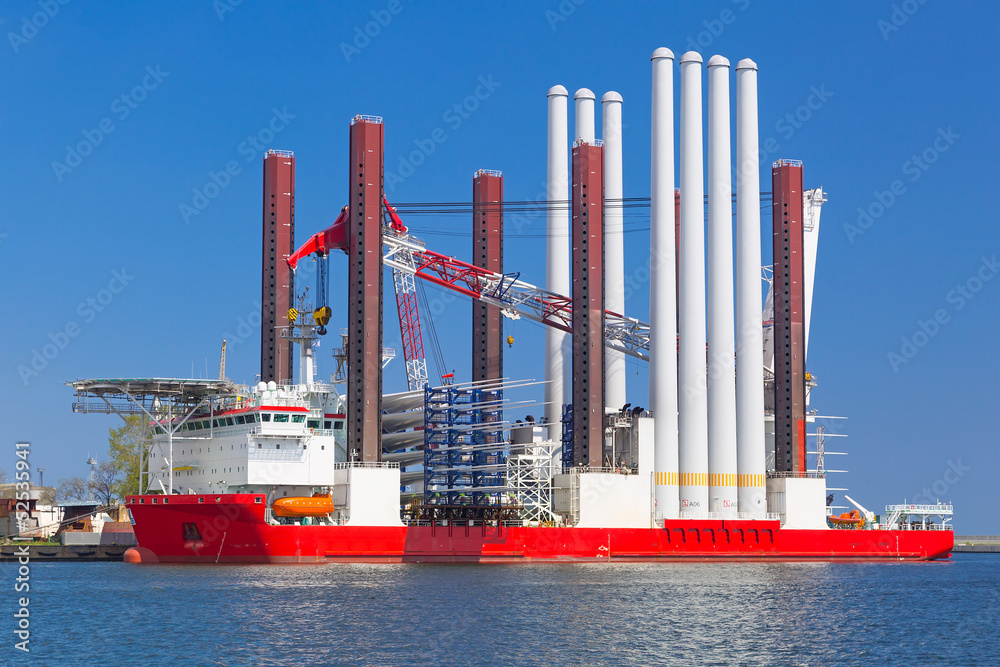 Wall mural shipyard in gdynia with wind turbine installation vessel, poland