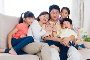 Fototapeta na wymiar Indoor portrait of asian family