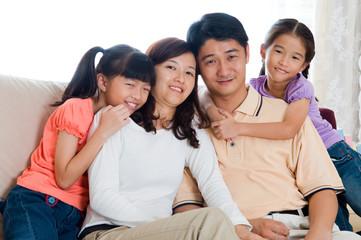 Indoor portrait of asian family