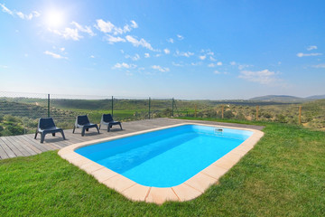 Lovely view of the beautiful pool and garden. On a sunny day.