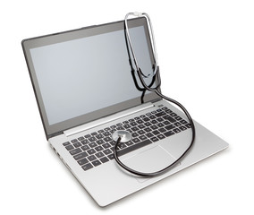 Medical stethoscope on a modern laptop, for the treatment of vir
