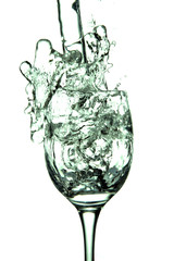 stream of water falling into the glass.