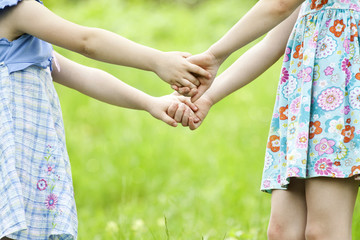 Close up on playing girl`s hands