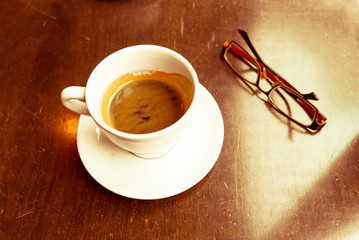 cup of hot coffee on table