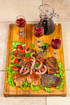 grilled meat, sausages  and  herbs with wine