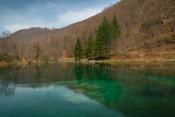 Beautiful emerald lake in spring landscape