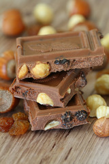 Milk chocolate with mixed nuts, close up
