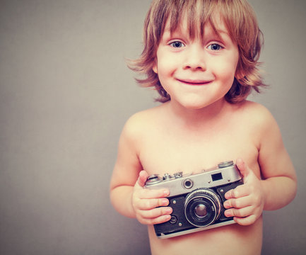 boy with an old camera
