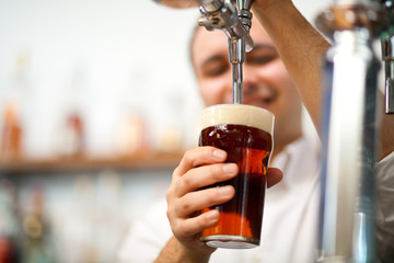 Bartender drawing a beer