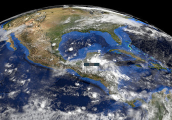 Fototapeta premium Guatemala flag on pole on earth globe illustration