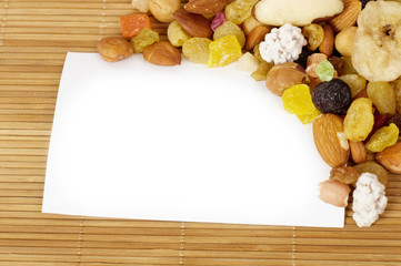 Fototapeta na wymiar Tasty nuts and berry with white blank paper
