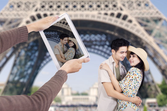 Romantic couple under Eiffel Tower Paris