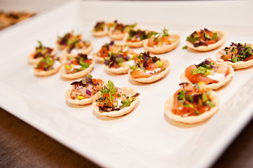 a plate of finger food, typically seen at a function