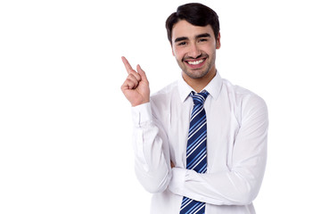 Smiling manager pointing backwards