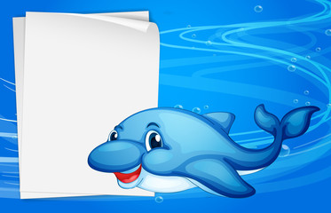 A dolphin beside an empty paper under the sea