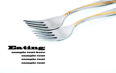 Two forks on a white background