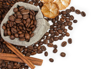 Coffee beans in a sack and spices on a white background