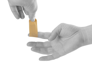 Hand putting Adhesive Bandage. Isolated on white.