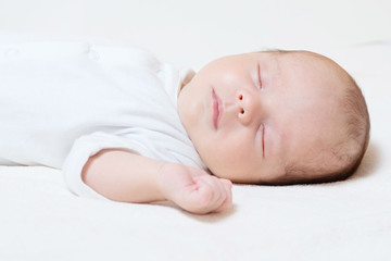 Fototapeta na wymiar detail of cute month old baby sleeping