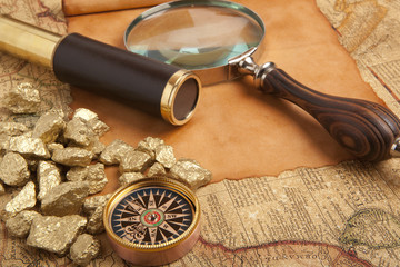 Gold nuggets on antique map