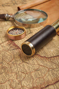 Brass telescope on map