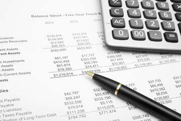 number or business financial chart or money analysis and benefit investment report with calculator and pen