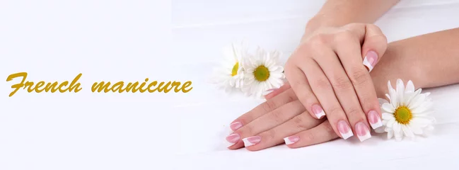  Woman hands with french manicure and flowers © Africa Studio