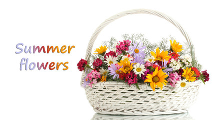 Beautiful bouquet of bright  wildflowers in basket isolated