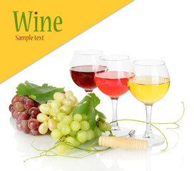 Glasses of wine and ripe grapes isolated on white