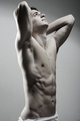 Young sexy muscular man posing
