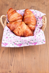 Croissants in a wooden basket