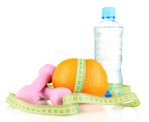 Orange with measuring tape, dumbbells and bottle of water,