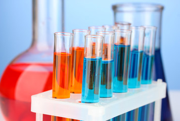 Test-tubes on color background