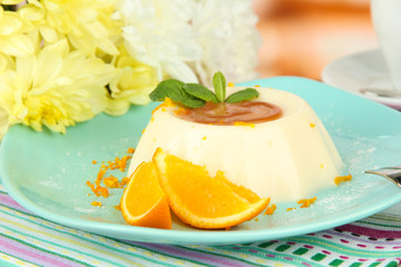 Panna Cotta with orange zest and caramel sauce,