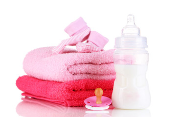 Obraz na płótnie Canvas Bottle for milk with towels and nipple isolated on white