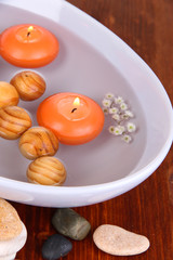 Beautiful candles swim in beautiful plate