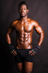 Fototapeta na wymiar Image of muscle man posing in studio