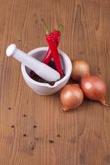 Pepper in mortar with pestle