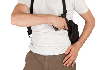 Close-up of a man with holster and a gun