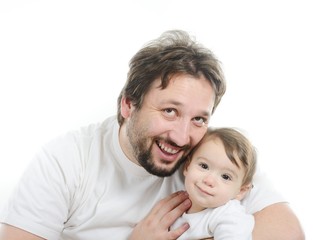 Happy young man holding a smiling 4-5 months old baby, isolated