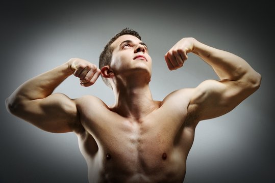 Young sexy muscular man posing