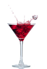 Red cocktail with splash isolated on white