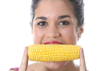 Model Released. Young Woman Eating Corn on the Cob