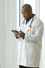 African American doctor holding a tablet