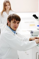 Young science workers research at medical lab