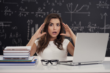 Terrified young woman in classroom