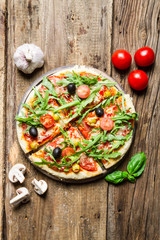 Freshly baked pizza with black olives