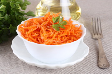 Carrot salad on white bowl