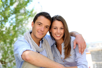 Cheerful couple relaxing in park